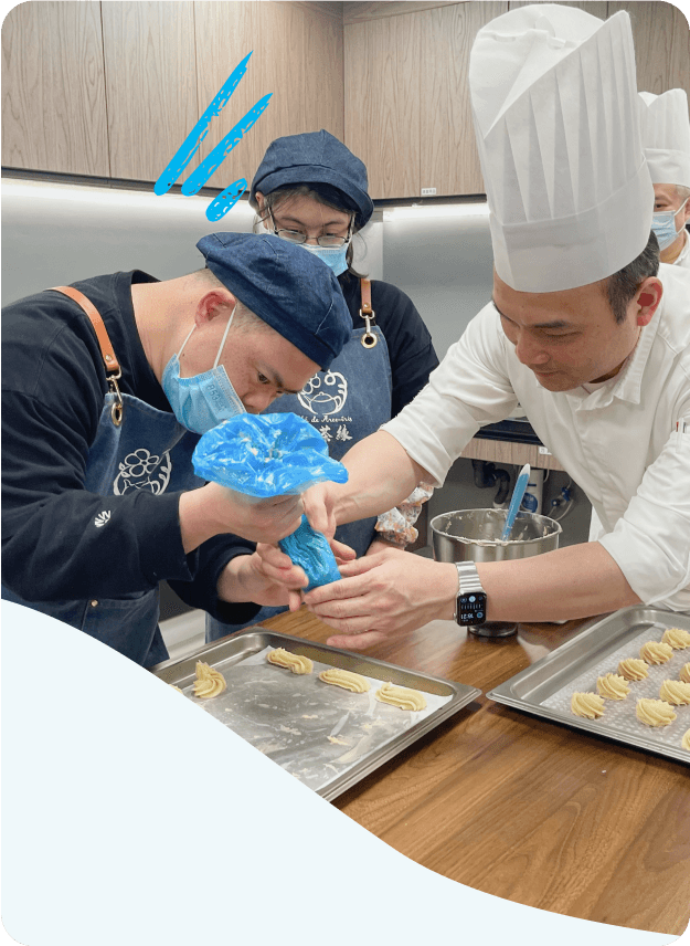 A chef guiding a student